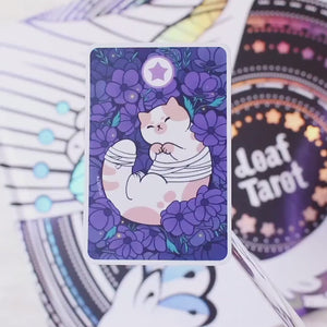
            
                Load and play video in Gallery viewer, Cat Tarot Card (Five of Pentacles) - Holographic Vinyl Sticker
            
        