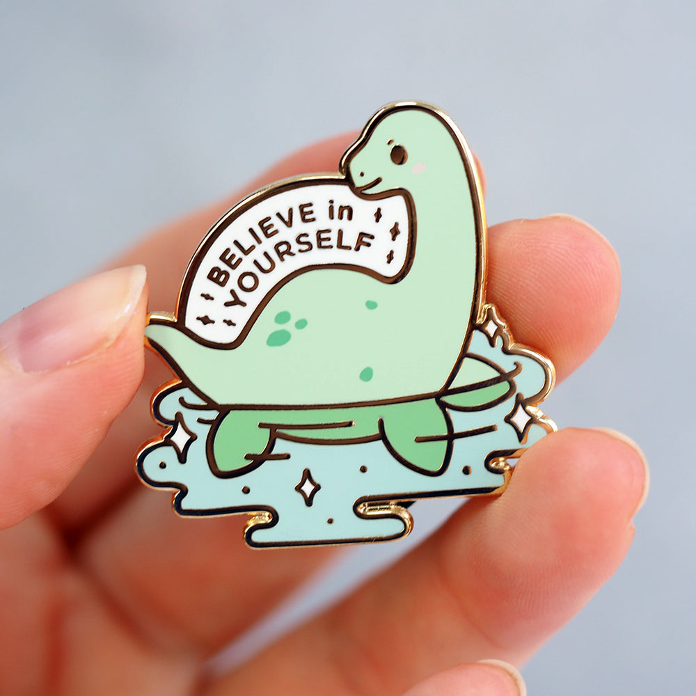 
            
                Load image into Gallery viewer, &amp;#39;Believe In Yourself&amp;#39; Loch Ness Monster - Metal Enameled Pin
            
        