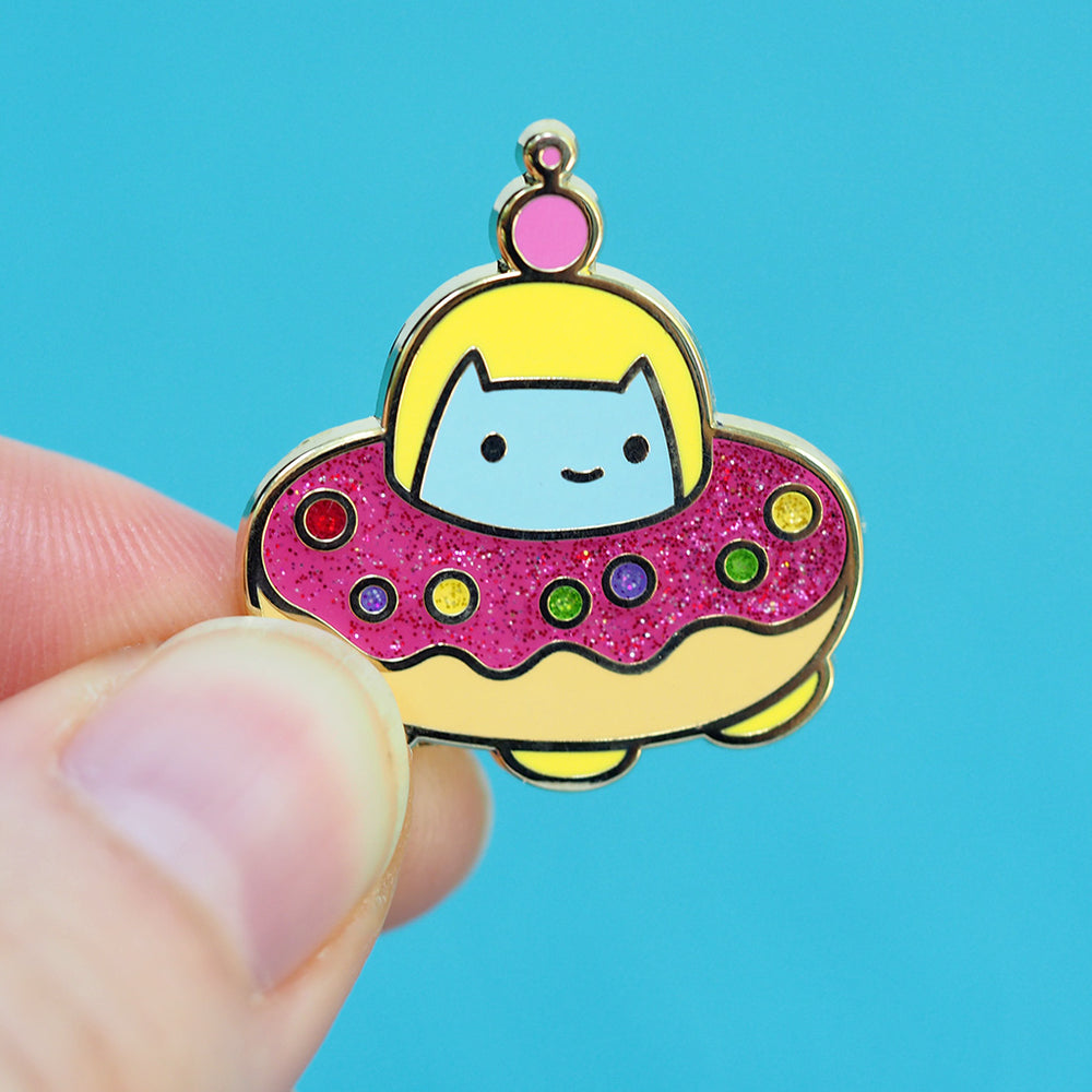
            
                Load image into Gallery viewer, Commander Kitty! Glitter Donut Spaceship - Metal Enameled Pin
            
        