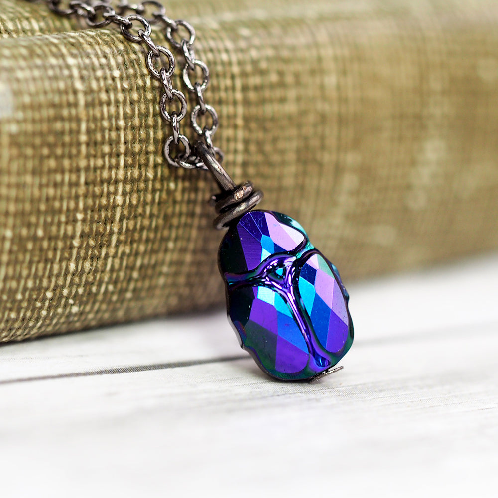 
            
                Load image into Gallery viewer, Magic Beetle Necklace - Midnight Purple &amp;amp; Blue
            
        