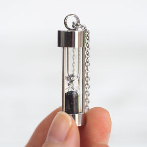 
            
                Load image into Gallery viewer, Iceland Black Sands of Time Hourglass Necklace
            
        