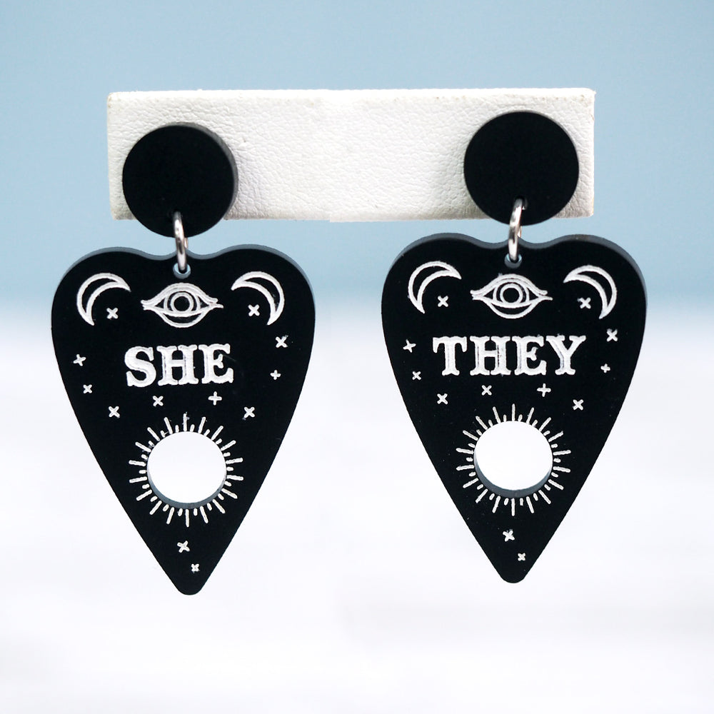 
            
                Load image into Gallery viewer, Pronoun Ouija Planchette Earrings - She/They
            
        