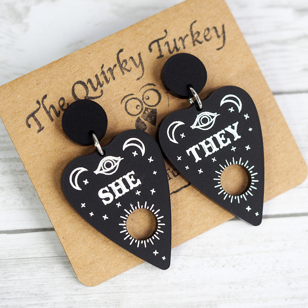 
            
                Load image into Gallery viewer, Pronoun Ouija Planchette Earrings - She/They
            
        