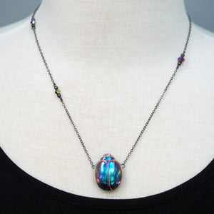 
            
                Load image into Gallery viewer, Magic Glass Beetle Necklace - Blue &amp;amp; Purple
            
        