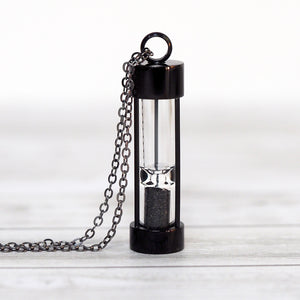 
            
                Load image into Gallery viewer, Iceland Black Sands of Time Hourglass Necklace - Black
            
        