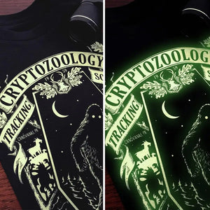 
            
                Load image into Gallery viewer, Cryptozoology Tracking Society Unisex T-Shirt - Glow in the Dark
            
        