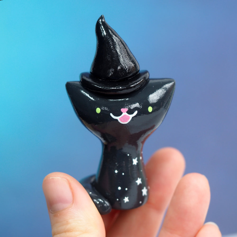 
            
                Load image into Gallery viewer, Starry Witch Cat Figurine
            
        